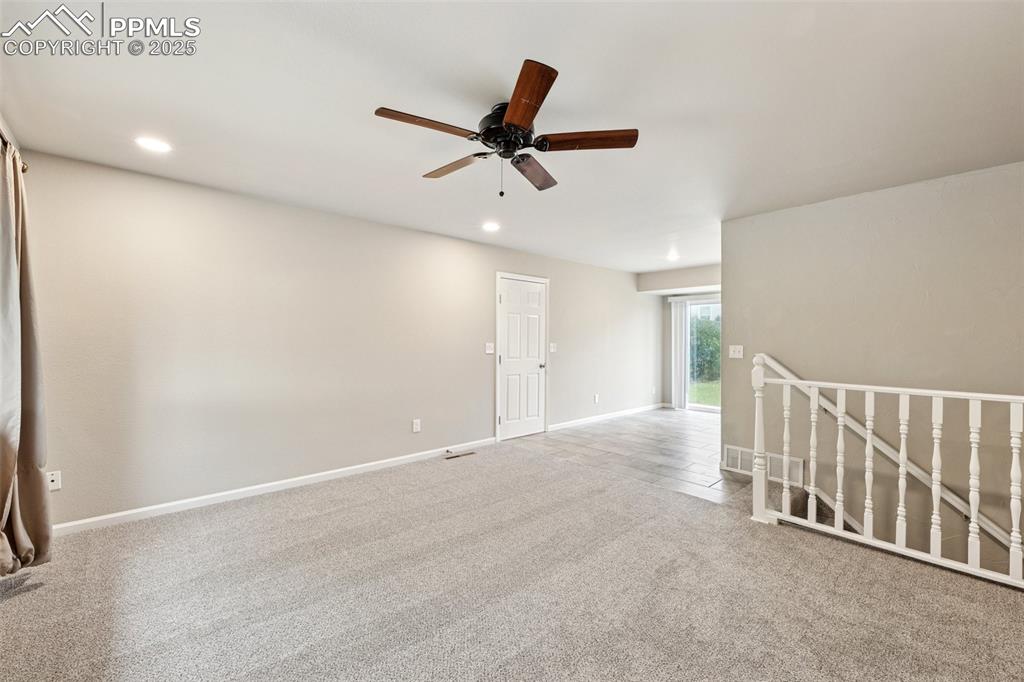 Image 5 of 37: Carpeted spare room with ceiling fan and recessed lighting