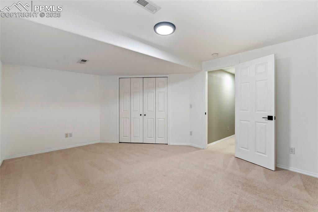 Image 31 of 39: Basement Bedroom