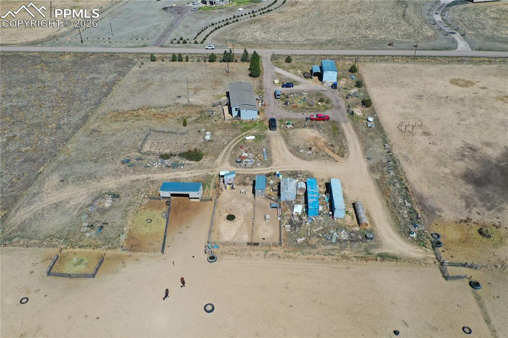 Image 11 of 31: Aerial view of property and surrounding area featuring rural landscape
