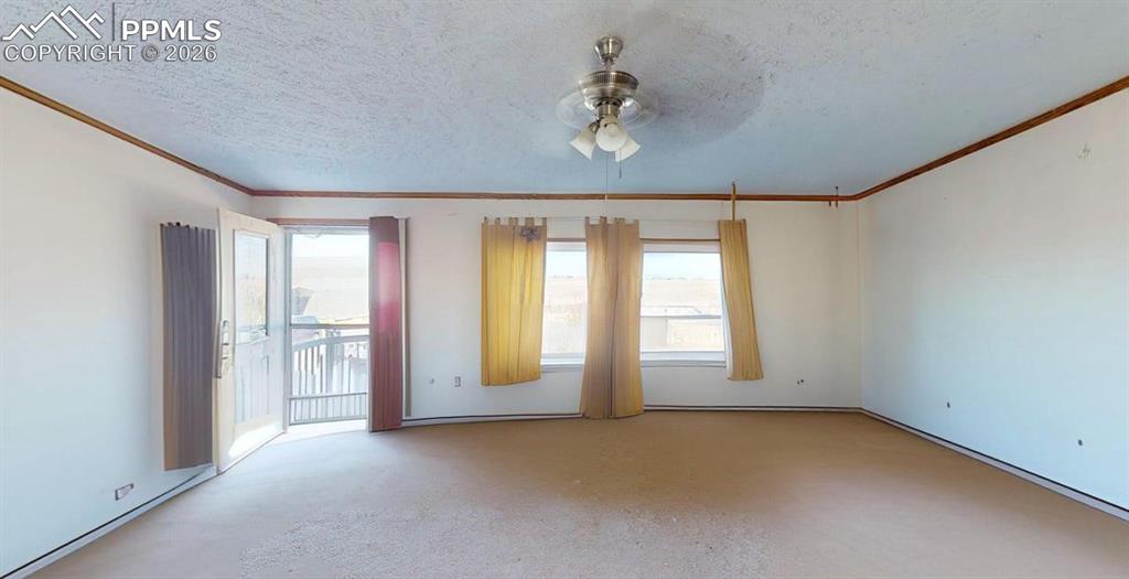 Image 17 of 31: Unfurnished room with a ceiling fan, a textured ceiling, healthy amount of