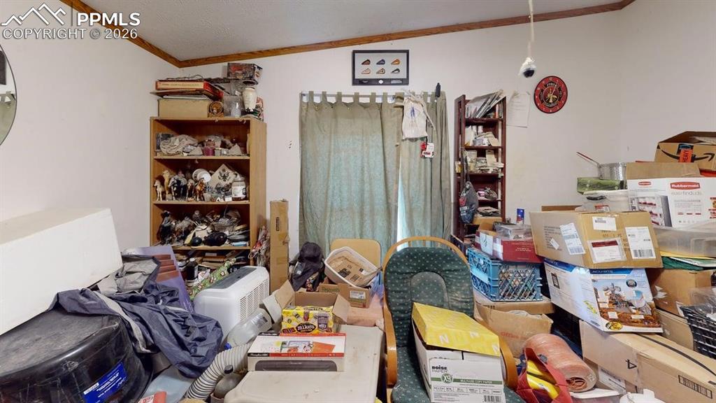 Image 22 of 31: Miscellaneous room featuring crown molding