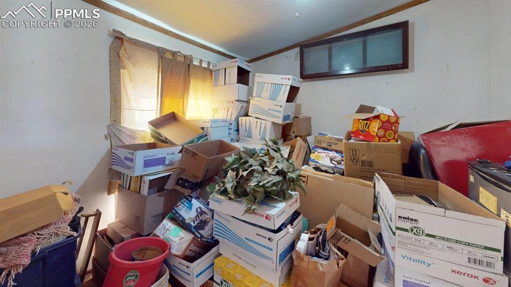 Image 24 of 31: Misc room with lofted ceiling