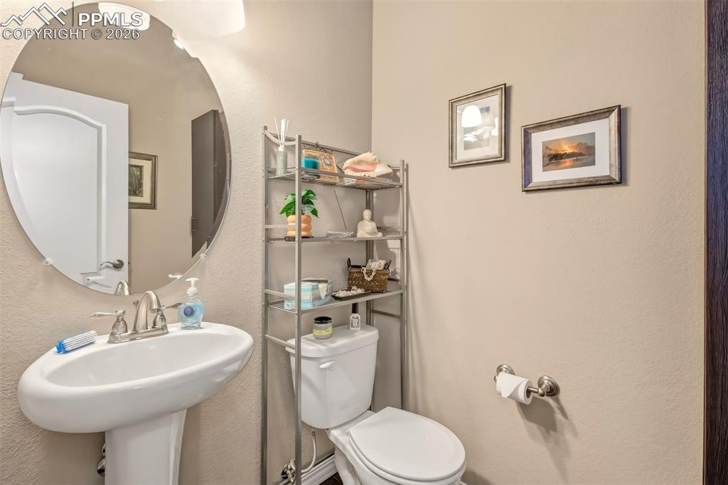 Image 14 of 32: Half bathroom main level 