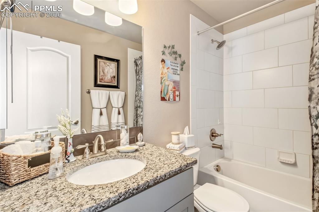 Image 21 of 32: Full bathroom on the upper level near bedroom 2 and 3