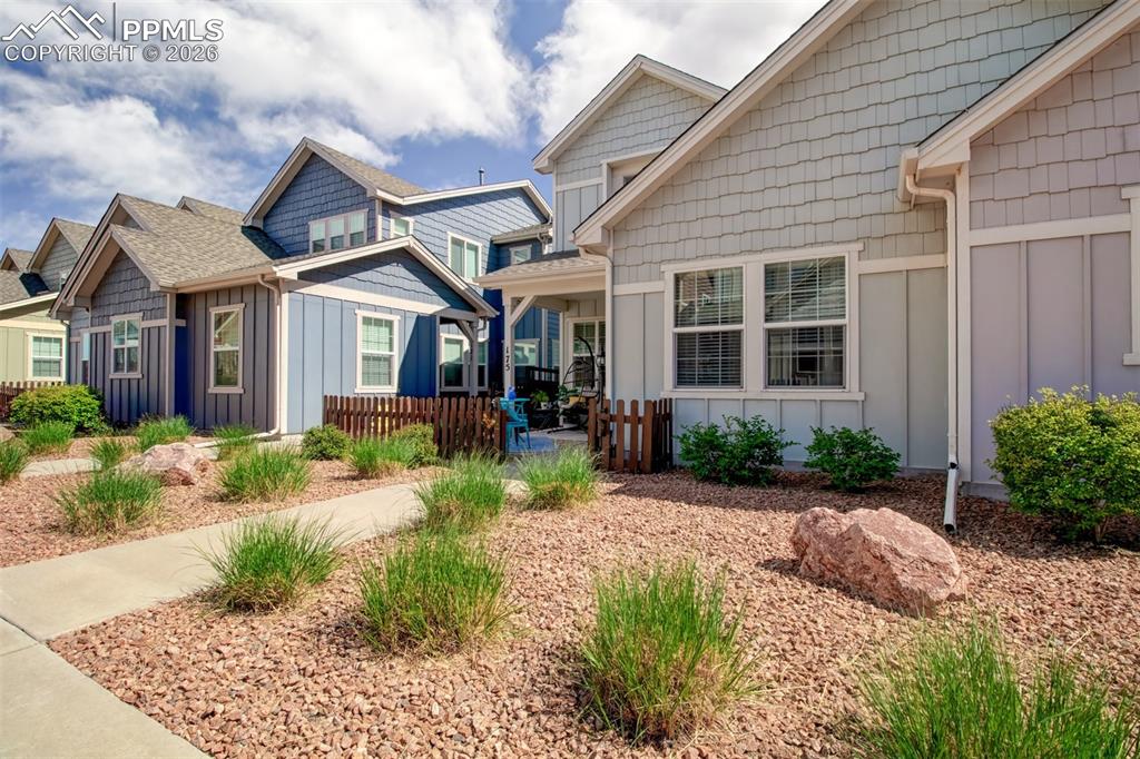Image 29 of 32: Front of this lovely townhome