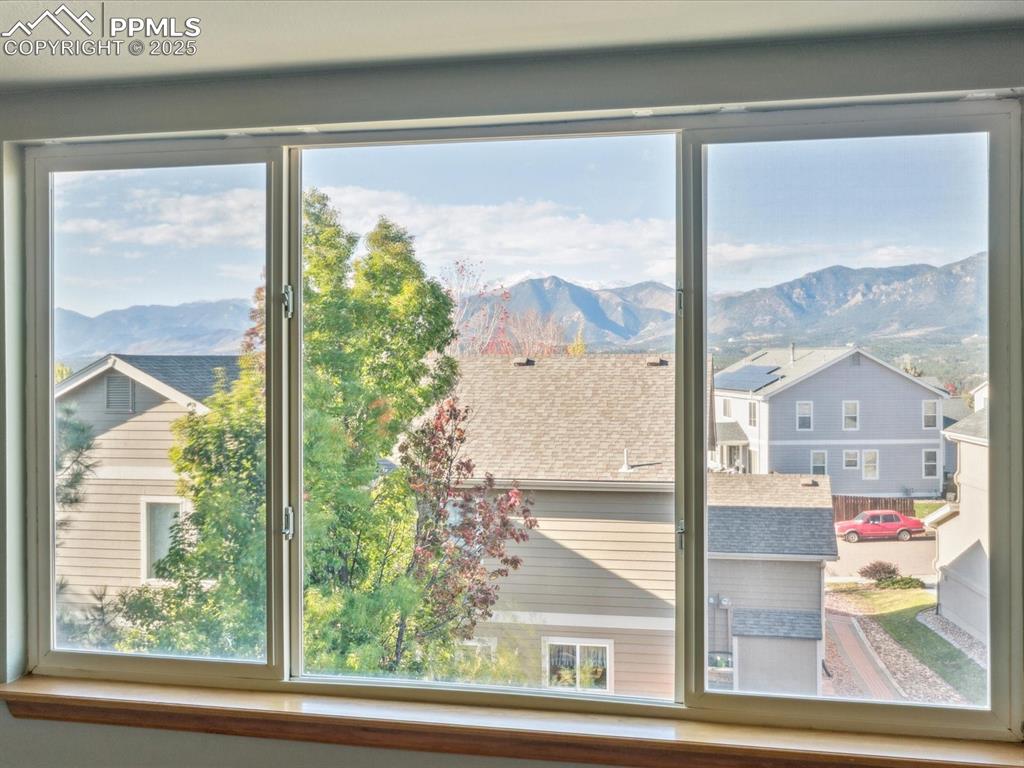 Image 11 of 45: Entryway featuring a mountain view and a residential view