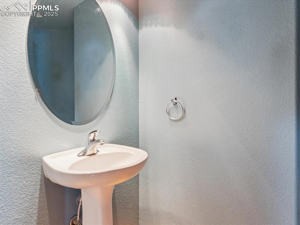 Image 25 of 45: Bathroom with a textured wall