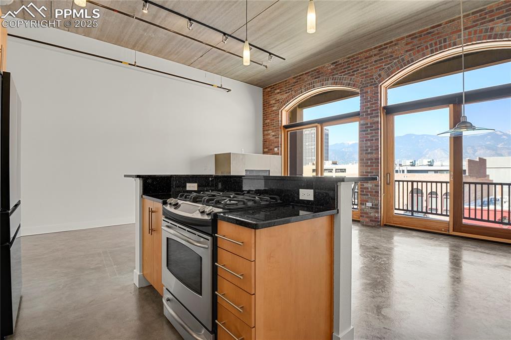 Image 11 of 42: Kitchen opens to Living/Dining areas