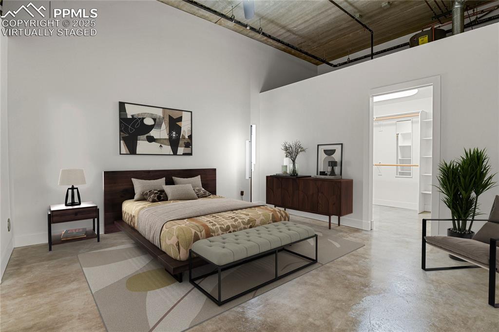 Image 21 of 42: Spacious bedroom with walk-in closet, laundry, and en-suite bath. Virtually