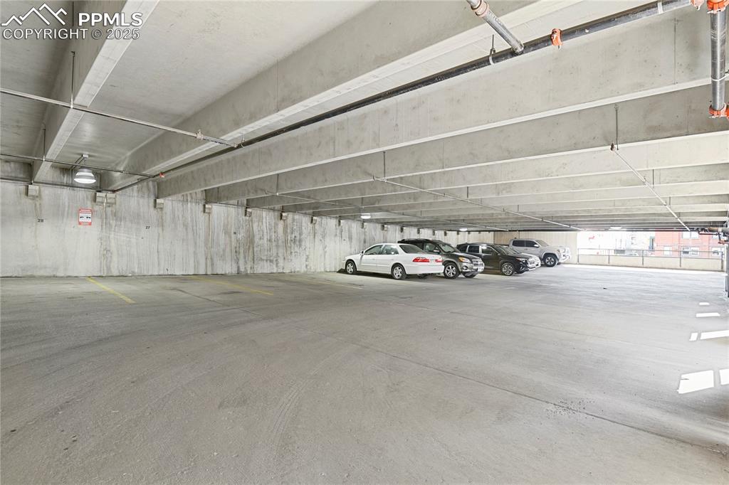 Image 34 of 42: Covered parking space on second level of the garage