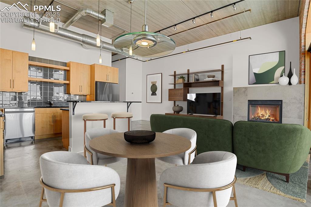 Image 5 of 42: Virtually Staged Living/Dining Area/Kitchen
