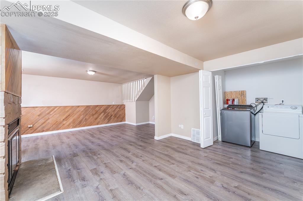 Image 29 of 30: Laundry closet in downstairs living room