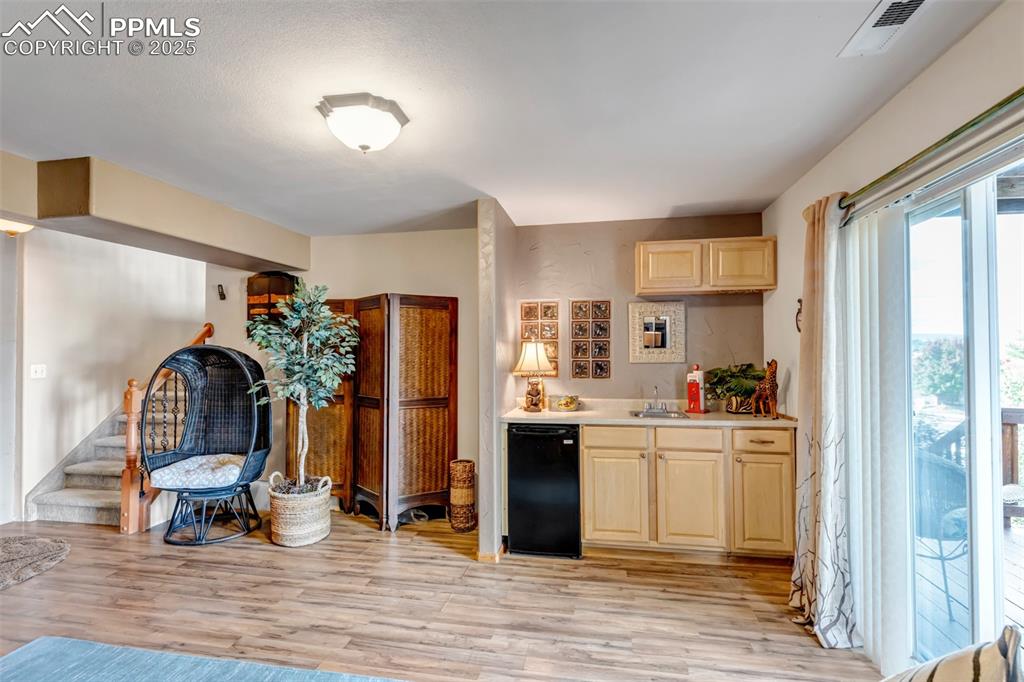 Image 39 of 50: Wet bar in 2nd Family Room walks out to patio!