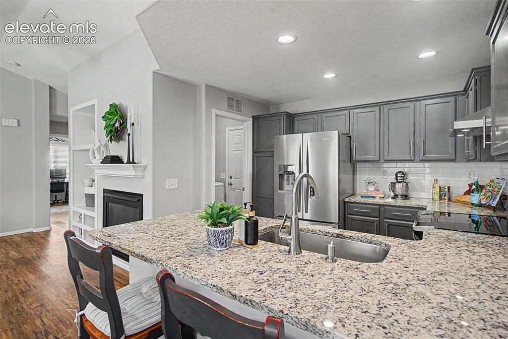 Image 17 of 48: Breakfast bar looking toward the updated kitchen!
