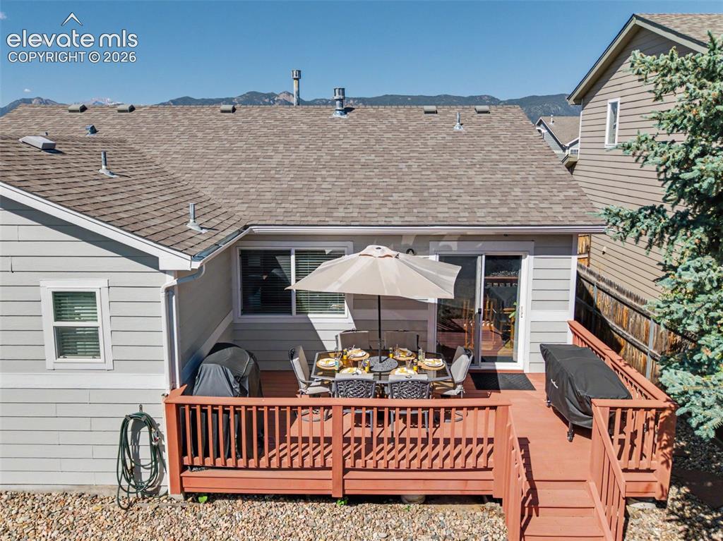 Image 26 of 48: The dining area opens out to the rear deck and backyard!