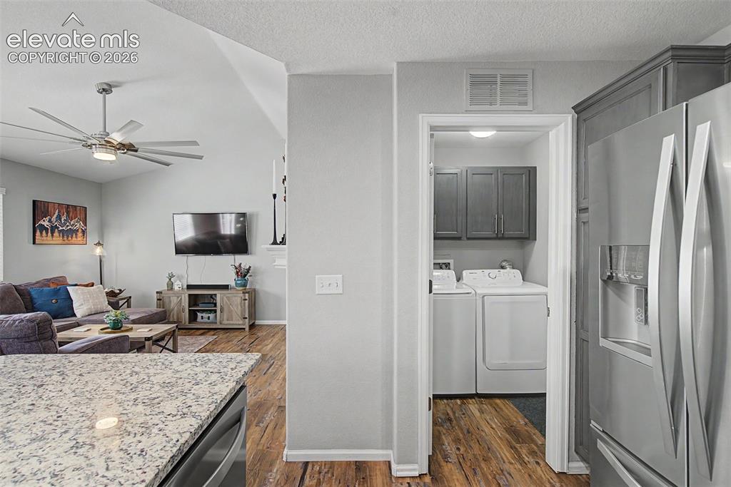 Image 28 of 48: The laundry room is adjacent to the kitchen!