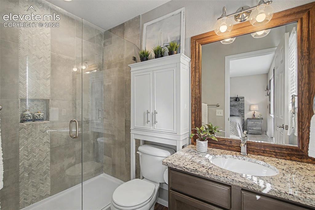 Image 33 of 48: Private Primary Bathroom features and oversized shower w/custom tile surrou