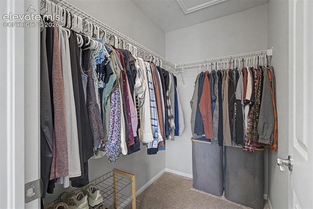 Image 35 of 48: Primary walk-in closet!