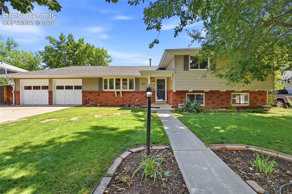 Caption: Landscaped Front lawn with irrigation 