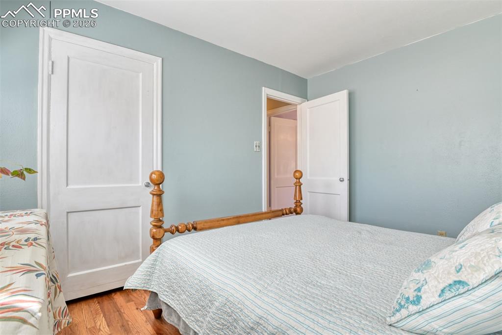 Image 19 of 47: Bedroom with wood finished floors