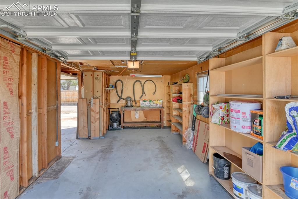 Image 43 of 47: Garage with a garage door opener
