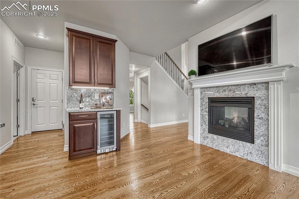 Image 11 of 48: A bar refrigerator near the kitchen