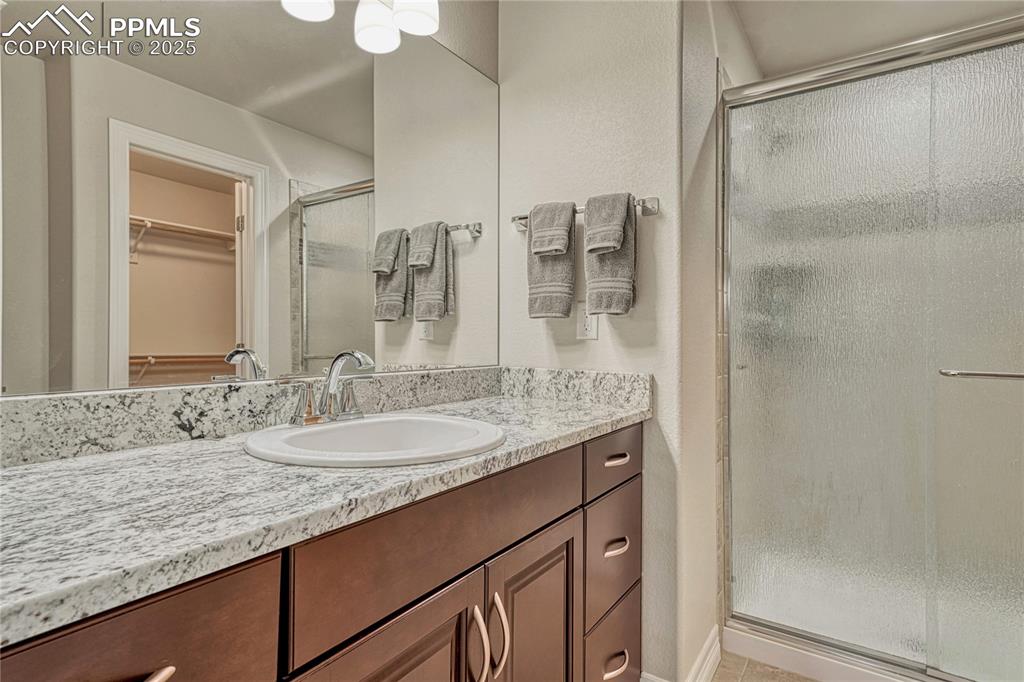 Image 31 of 48: Attached bath to bedroom (used as an office)