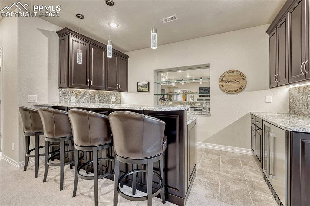 Image 34 of 48: Wet bar has everything you need
