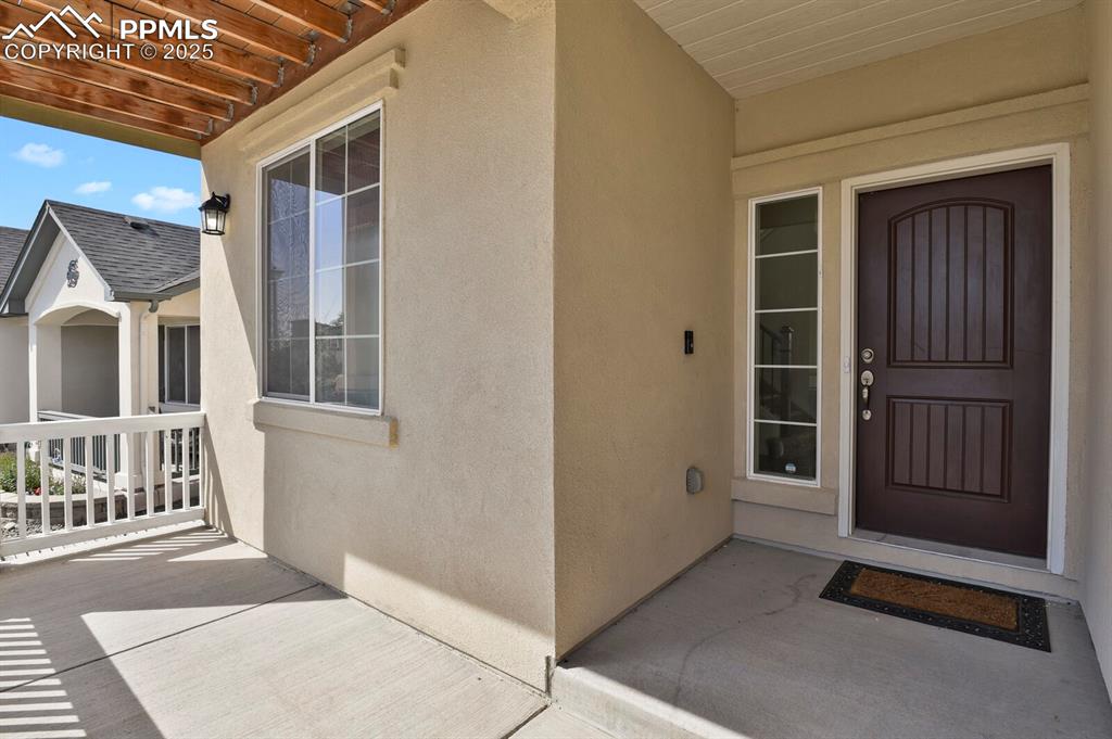 Image 2 of 31: View of exterior entry featuring stucco siding