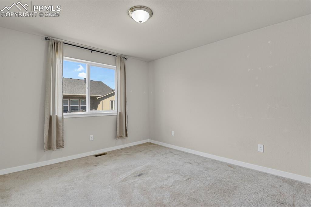 Image 22 of 31: Carpeted spare room featuring baseboards