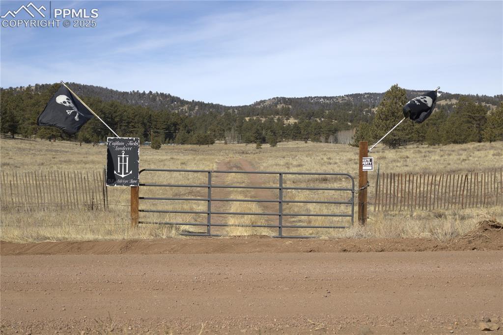 Image 14 of 20: Gate from road