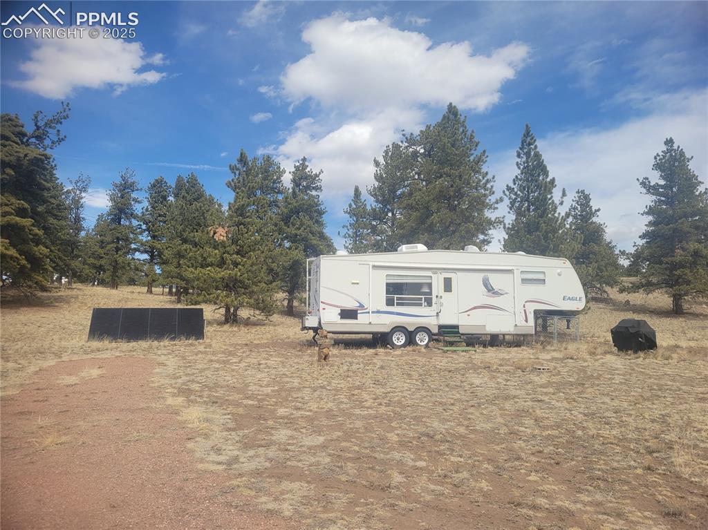 Image 2 of 20: Fifth wheel and solar panel