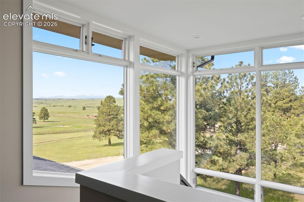Image 20 of 36: One of the best views in the house is from the glass-enclosed staircase.