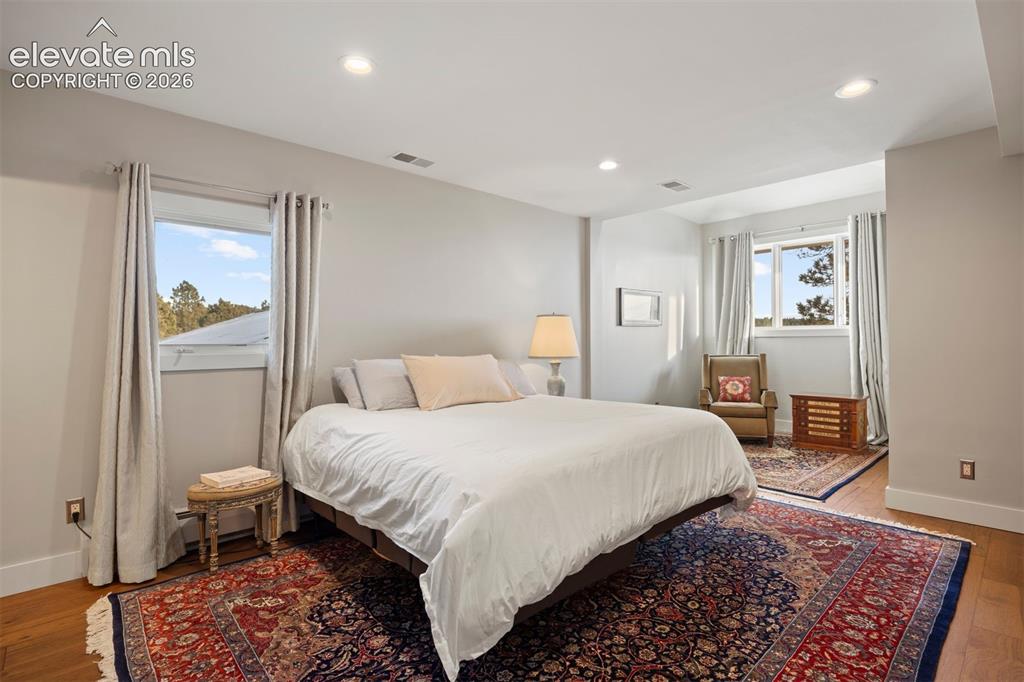 Image 22 of 36: Second upstairs bedroom with sitting area and private ensuite.