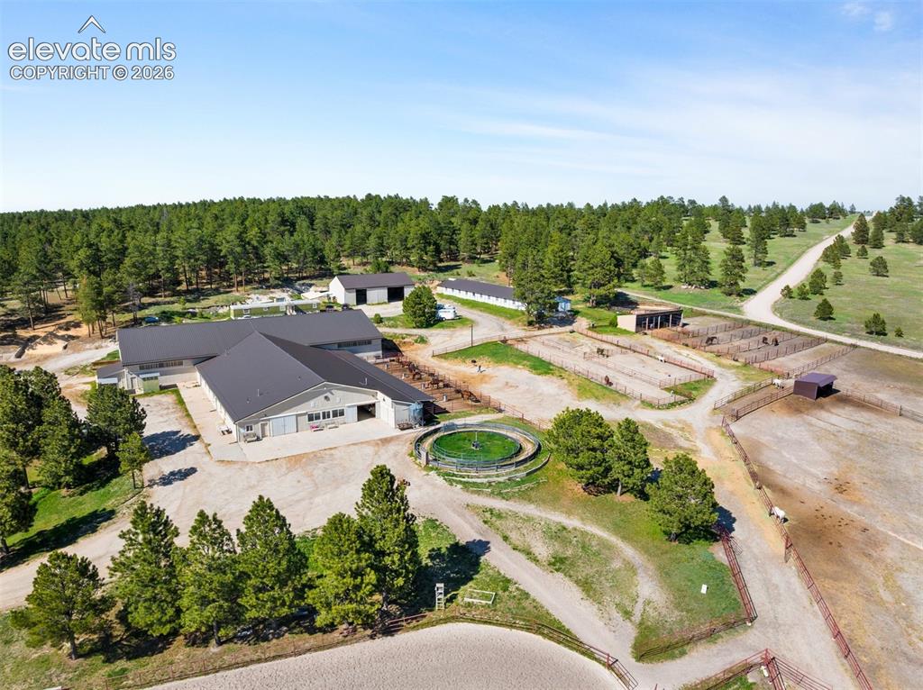Image 26 of 36: The equestrian facilities include two impressive barns, an 11,000 sq ft. in