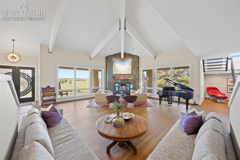 Image 5 of 36: Soaring ceilings with tongue-and-groove and beams create scale, while detai