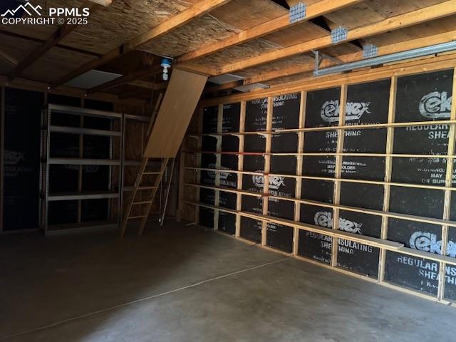 Image 16 of 19: Wine room with concrete flooring