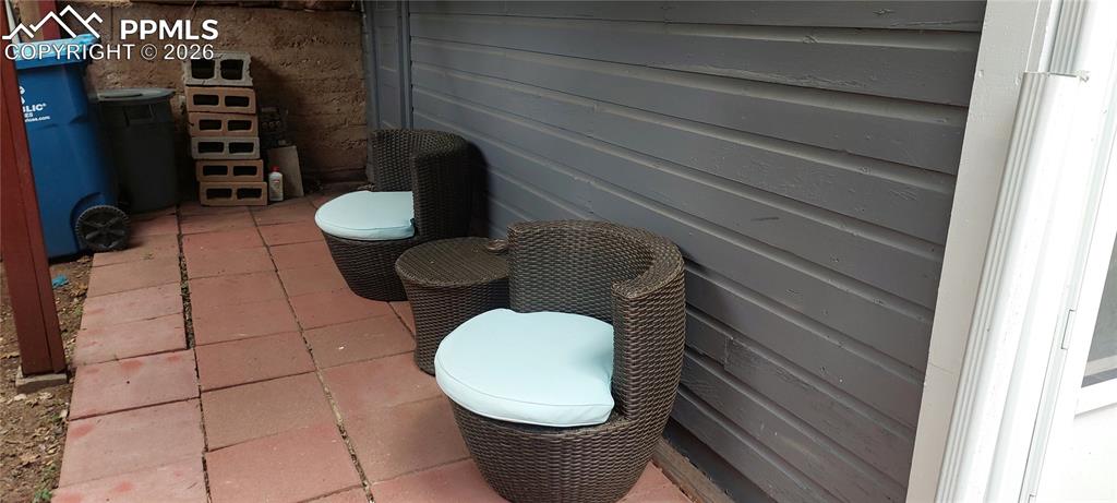 Image 24 of 29: Lower level rear covered patio