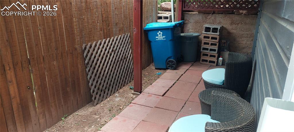 Image 25 of 29: Lower level rear covered patio