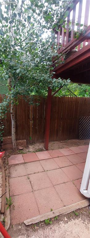 Image 26 of 29: Lower level rear covered patio