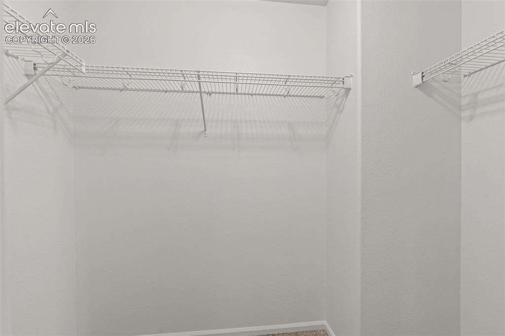 Image 17 of 31: Walk in closet