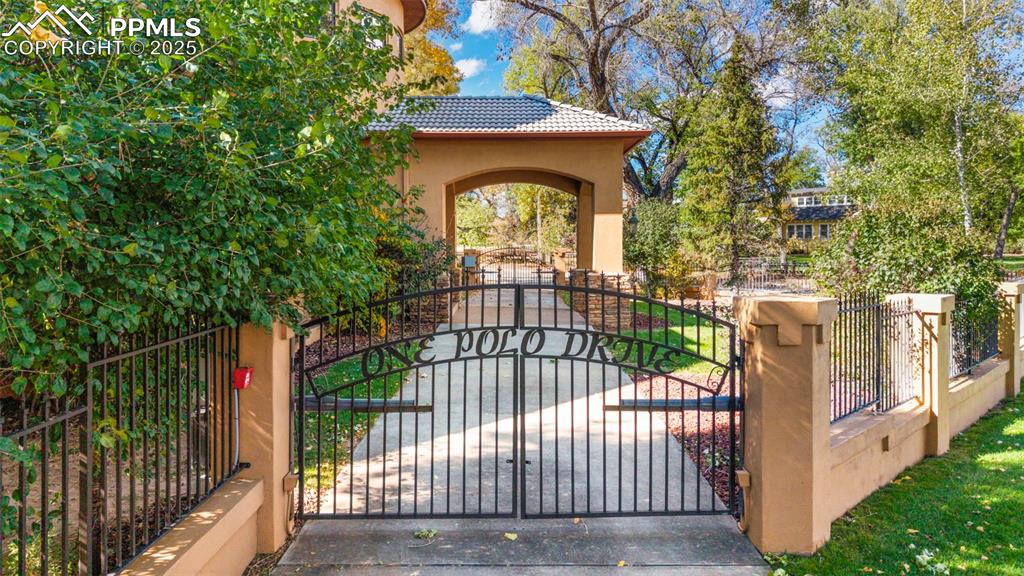 Image 2 of 50: Gated Drive-Through Driveway