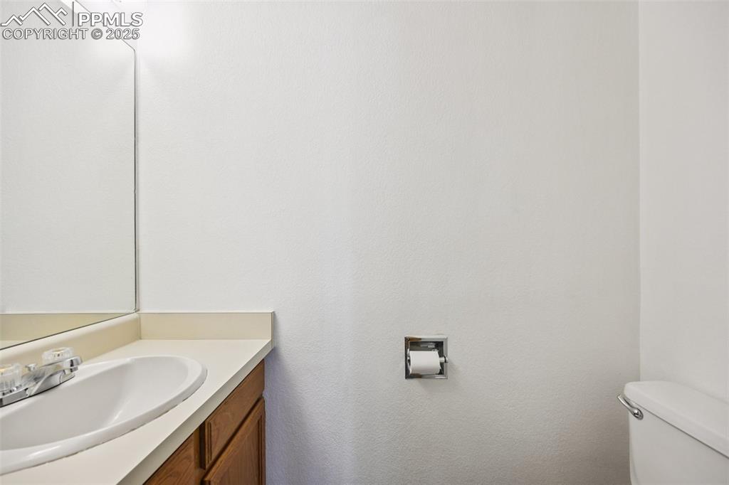 Image 13 of 28: Bathroom with vanity and toilet