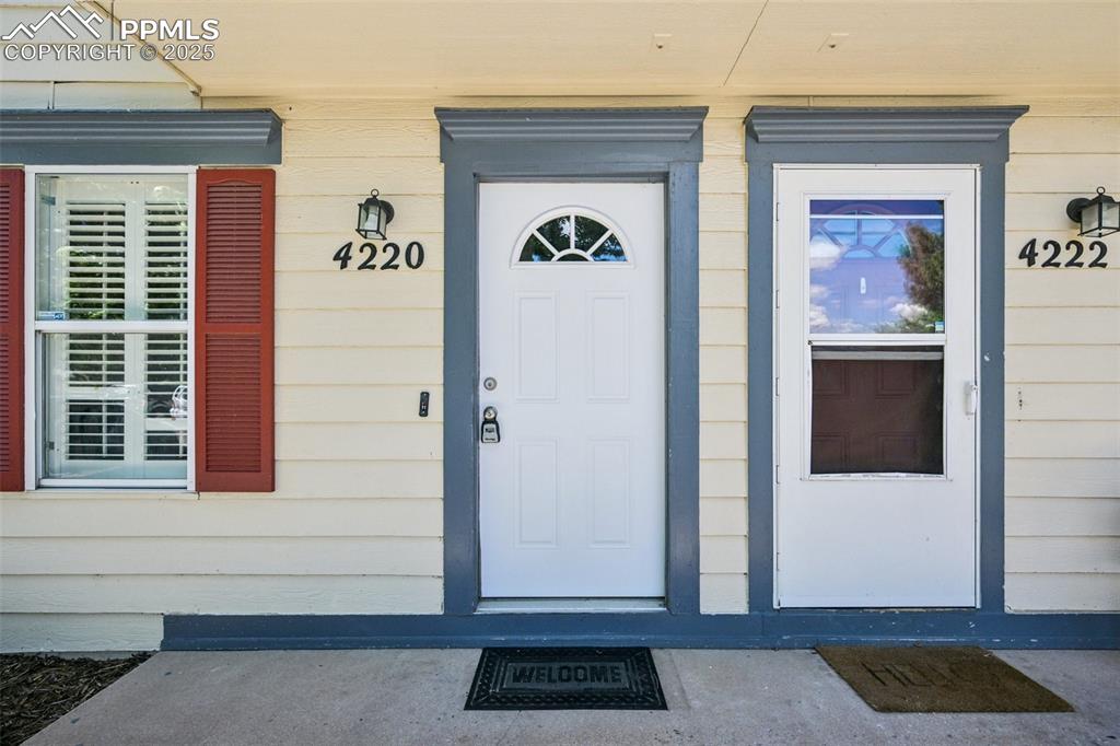 Image 2 of 28: View of exterior entry with covered porch