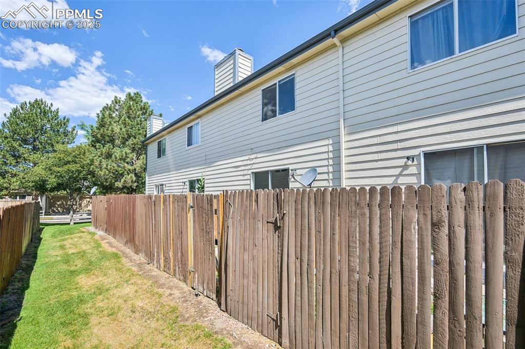 Image 27 of 28: View of property exterior featuring a chimney