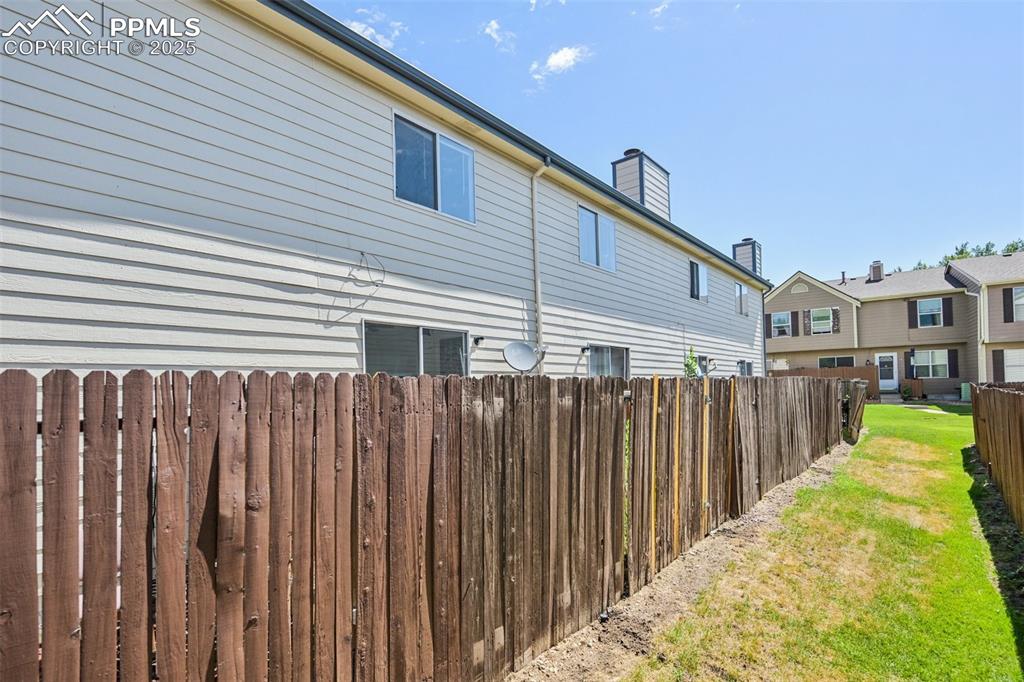 Image 28 of 28: View of property exterior with a chimney
