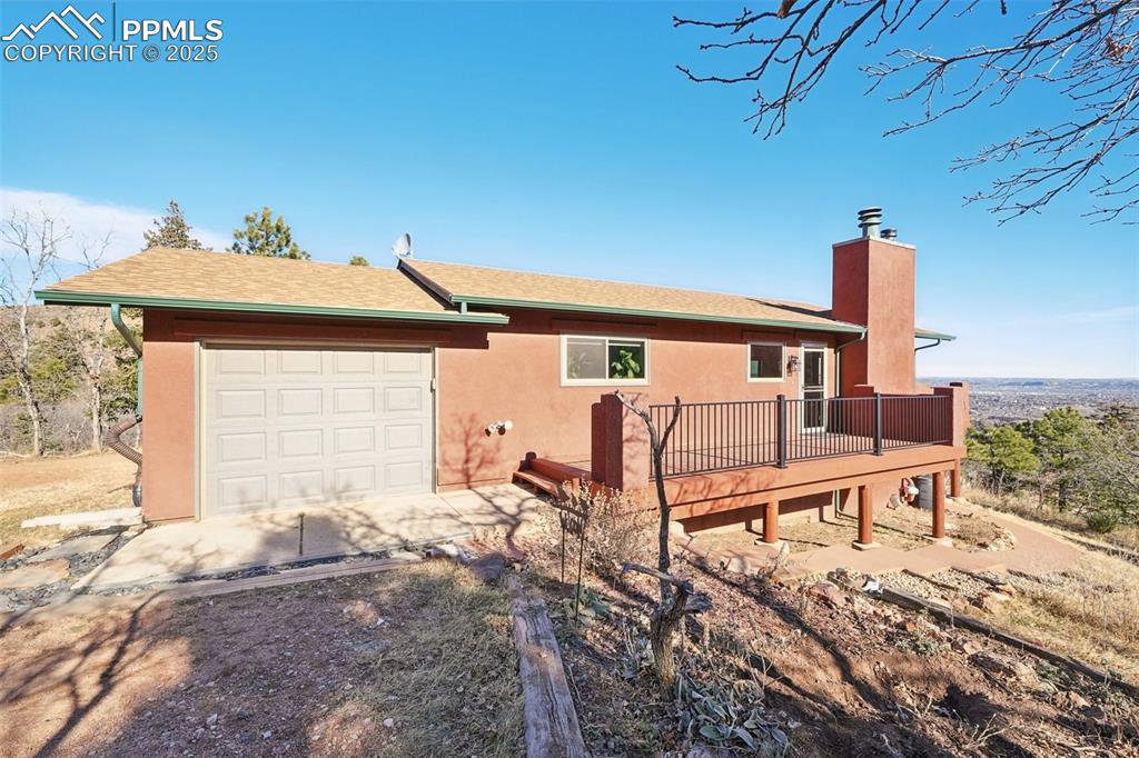 Caption: Front of this amazing mountain home that is just minutes from downtown Manitou Springs!