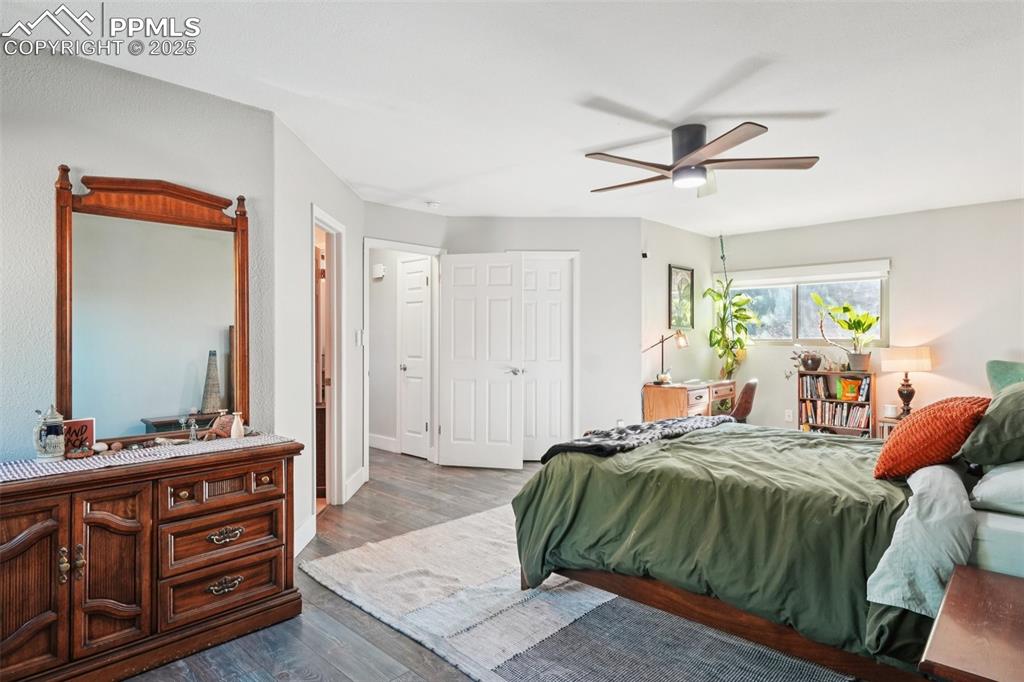 Image 15 of 38: Primary bedroom on the main level with attached 4 piece bathroom and walk i