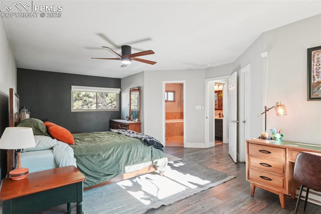 Image 16 of 38: Primary bedroom with walk in closet and attached primary bathroom