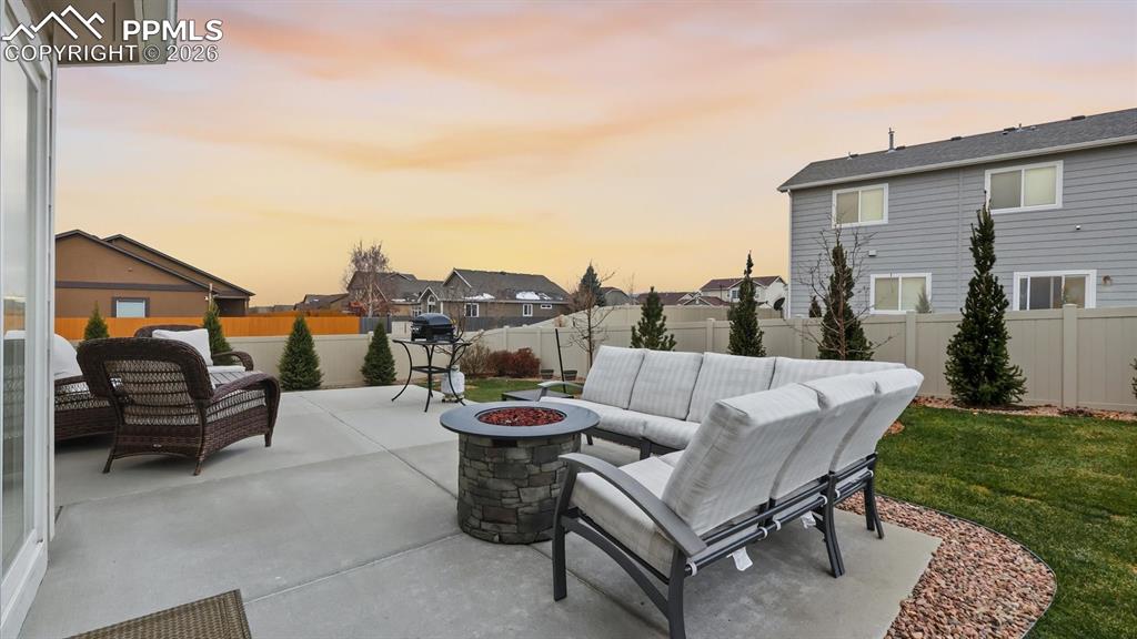 Image 16 of 50: Spacious backyard patio for outdoor dining and relaxation.